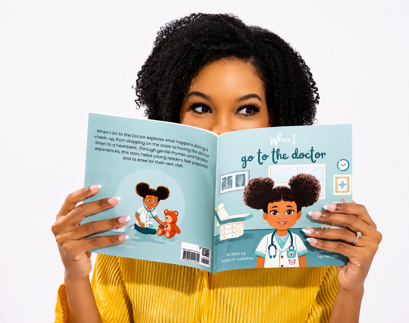 Zakiyah Everette peeking over 'When I go to the doctor' book